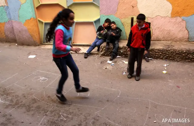 Palestinian children play in alley in one of the most poor regions at Sabra and Shatila Palestinian refugee camp in Beirut, in Lebanon, March 5, 2012. About 11,000 person live in this poor refugee camp who face hard and...