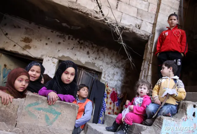 Palestinian children play in alley in one of the most poor regions at Sabra and Shatila Palestinian refugee camp in Beirut, in Lebanon, March 5, 2012. About 11,000 person live in this poor refugee camp who face hard and...