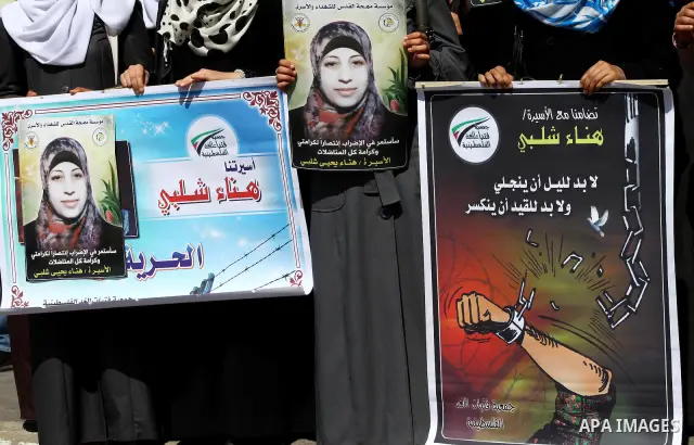 A Palestinian students of university demonstrate in solidarity with Hana'a Shalabi during a protest in front of red cross in Gaza City, on mar. 06, 2012. Shalabi, released by Israel in a prisoner swap last year but re-ar...