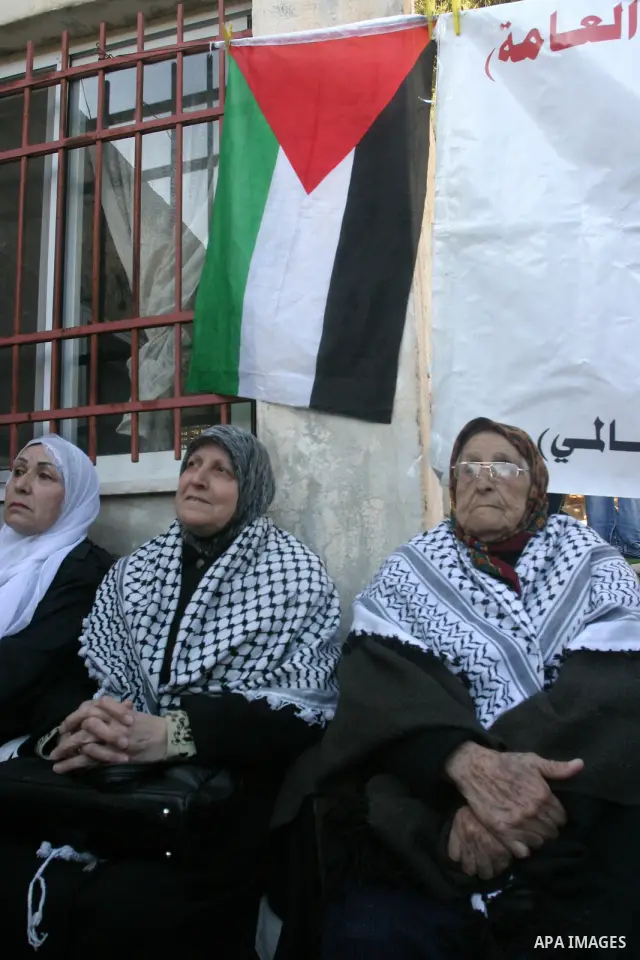 Palestinian women take part in marking the International Woman's Day in the Sheikh Jarrah in Jerusalem's Old City's , on March 8, 2012. Photo by Mahfouz Abu Turk