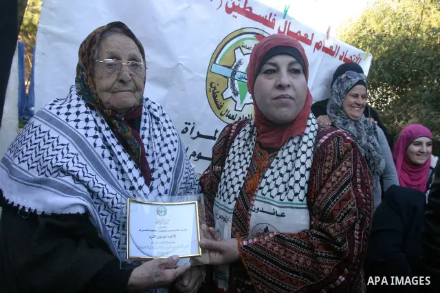 Palestinian women take part in marking the International Woman's Day in the Sheikh Jarrah in Jerusalem's Old City's , on March 8, 2012. Photo by Mahfouz Abu Turk