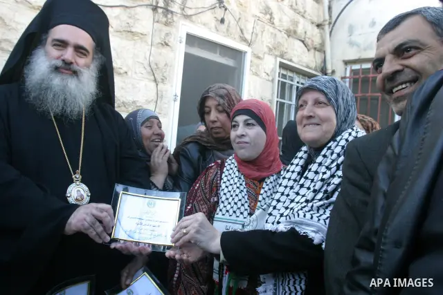 Palestinian women take part in marking the International Woman's Day in the Sheikh Jarrah in Jerusalem's Old City's , on March 8, 2012. Photo by Mahfouz Abu Turk
