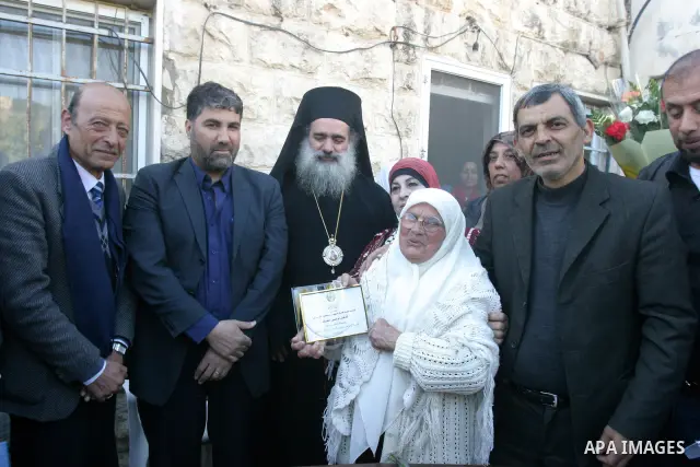 Palestinian women take part in marking the International Woman's Day in the Sheikh Jarrah in Jerusalem's Old City's , on March 8, 2012. Photo by Mahfouz Abu Turk