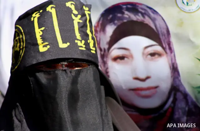 Palestinian women demonstrate in solidarity with Hana'a Shalabi during a protest in front of red cross in Gaza City, on mar. 07, 2012. Shalabi, released by Israel in a prisoner swap last year but re-arrested earlier this...