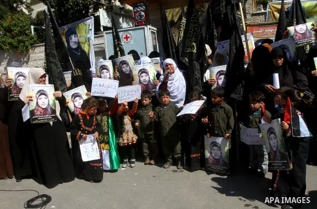 Palestinian women demonstrate in solidarity with Hana'a Shalabi during a protest in front of red cross in Gaza City, on mar. 07, 2012. Shalabi, released by Israel in a prisoner swap last year but re-arrested earlier this...