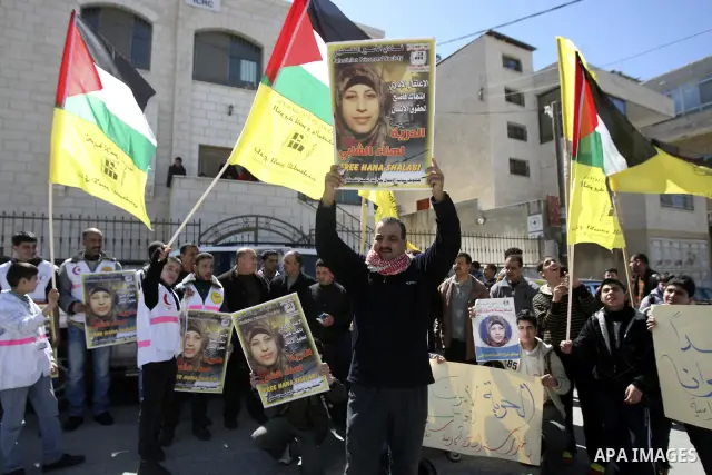 Palestinians take part in a protest in solidarity with Hana Shalabi, a Palestinian prisoner jailed in Israel and who has been on hunger strike for 21 days, in the West Bank in Nablus, Wednesday, March 7, 2012. Palestinia...