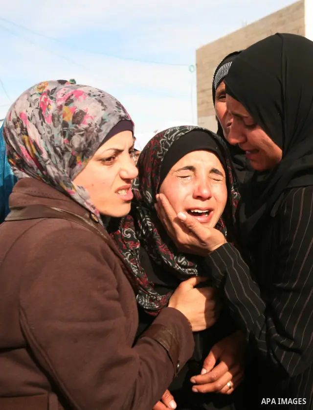 Palestinian women mourn during the funeral of two boys who were killed the previous day when unexploded military ordinance detonated outside Hebron, during their funeral in Wadi al-Rim, West Bank, 07 March 2012. Palestin...