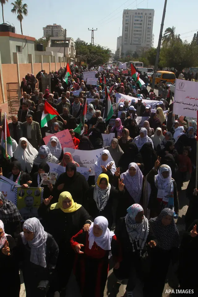 A Palestinian woman hold a poster during a protest calling for the release of Hana Shalabi, a female Palestinian prisoner jailed in Israel who has been on hunger strike for 22 days, outside the Red Cross building in Gaza...