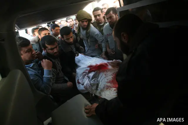 Palestinian carry the body of Zuhair al-Qaissi, a commanderl of the armed wing of the Popular Resistance Committees (PRC) in Gaza City, Friday, March 9, 2012. An Israeli airstrike killed top Palestinian militant commande...
