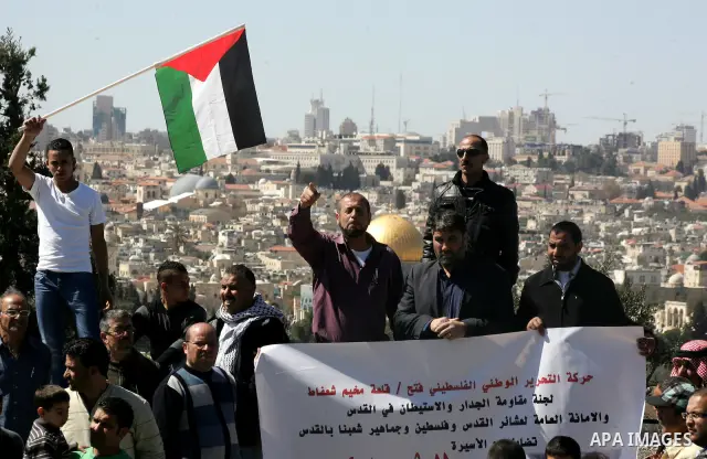 Palestinian protesters demonstrate near the Dome of the Rock in the Al-Aqsa mosque compound against a decision by the Jerusalem municipality and Israel's Nature and Parks Authority (NPA) to build a national park on Pales...