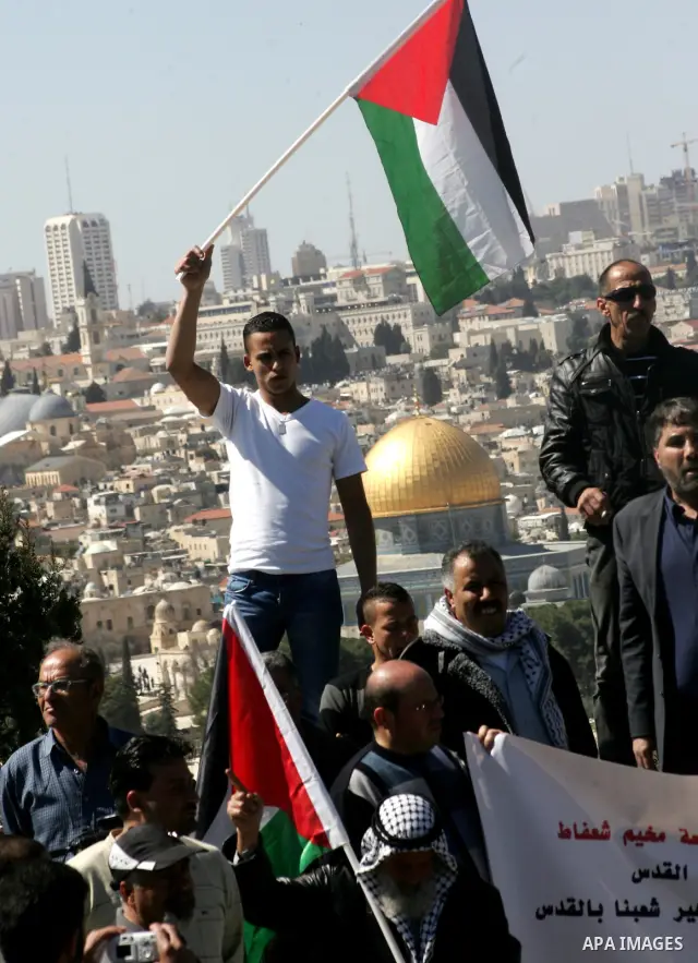 Palestinian protesters demonstrate near the Dome of the Rock in the Al-Aqsa mosque compound against a decision by the Jerusalem municipality and Israel's Nature and Parks Authority (NPA) to build a national park on Pales...