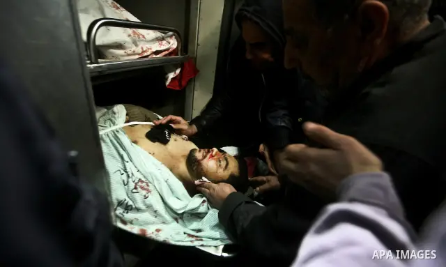 Palestinian mourn over the body islamic Jehad militant Hazem Kerekeaa in the al-Shifa hospital morgue on March 9, 2012, bringing the number of Palestinians killed in a day of cross-boarder fighting to four after a second...
