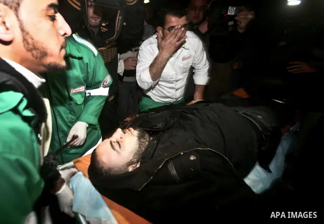Palestinian mourn over the body islamic Jehad militant Hazem Kerekeaa in the al-Shifa hospital morgue on March 9, 2012, bringing the number of Palestinians killed in a day of cross-boarder fighting to four after a second...