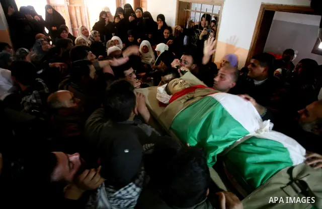 Palestinians carry the bodies of Islamic Jihad militants during their funeral in Gaza March 10, 2012. Israel killed two more Gaza militants on Saturday, raising the death toll in two days of violence to 12 and dozens of...