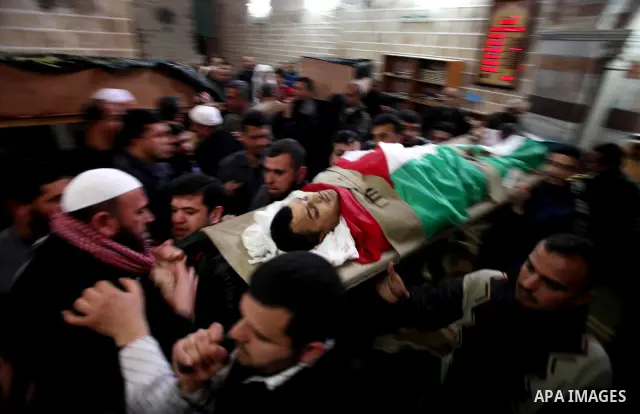 Palestinians carry the bodies of Islamic Jihad militants during their funeral in Gaza March 10, 2012. Israel killed two more Gaza militants on Saturday, raising the death toll in two days of violence to 12 and dozens of...