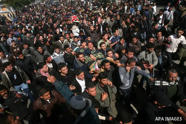 Palestinian mourners carry the bodies of seven Islamic Jihad militants (not all seen in picture), who were killed in Israeli air strikes, during their funeral in Gaza City on March 10, 2012. Twelve Palestinian fighters w...