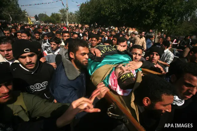 Palestinian mourners carry the bodies of seven Islamic Jihad militants (not all seen in picture), who were killed in Israeli air strikes, during their funeral in Gaza City on March 10, 2012. Twelve Palestinian fighters w...