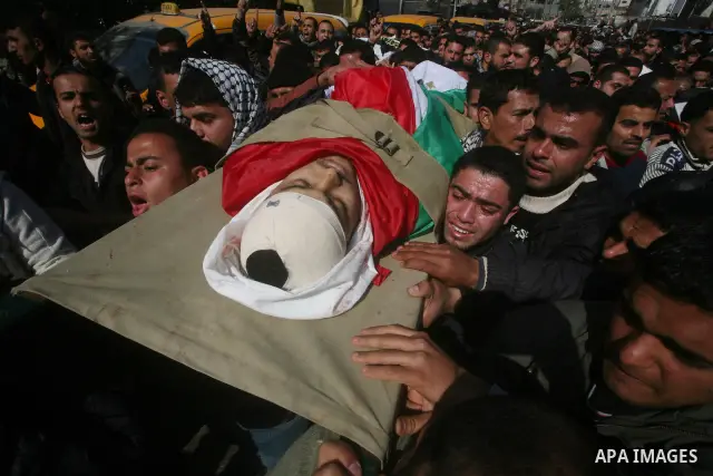 Palestinian mourners carry the bodies of seven Islamic Jihad militants (not all seen in picture), who were killed in Israeli air strikes, during their funeral in Gaza City on March 10, 2012. Twelve Palestinian fighters w...