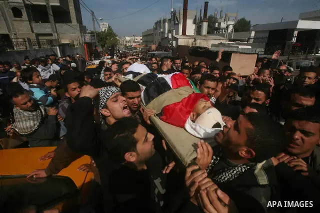 Palestinian mourners carry the bodies of seven Islamic Jihad militants (not all seen in picture), who were killed in Israeli air strikes, during their funeral in Gaza City on March 10, 2012. Twelve Palestinian fighters w...