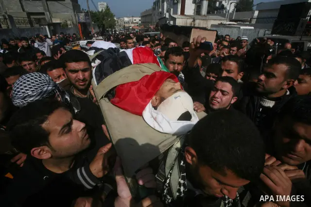 Palestinian mourners carry the bodies of seven Islamic Jihad militants (not all seen in picture), who were killed in Israeli air strikes, during their funeral in Gaza City on March 10, 2012. Twelve Palestinian fighters w...