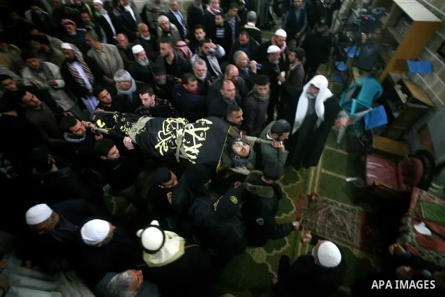 Palestinians carry the bodies of Islamic Jihad militants during their funeral in Gaza March 10, 2012. Israel killed two more Gaza militants on Saturday, raising the death toll in two days of violence to 12 and dozens of...