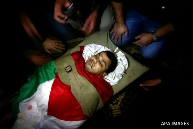 Palestinian relatives of Islamic Jihad militant Ahmed Hajaj mourns during his funeral in Gaza March 10, 2012. Israel killed two more Gaza militants on Saturday, raising the death toll in two days of violence to 12 and do...
