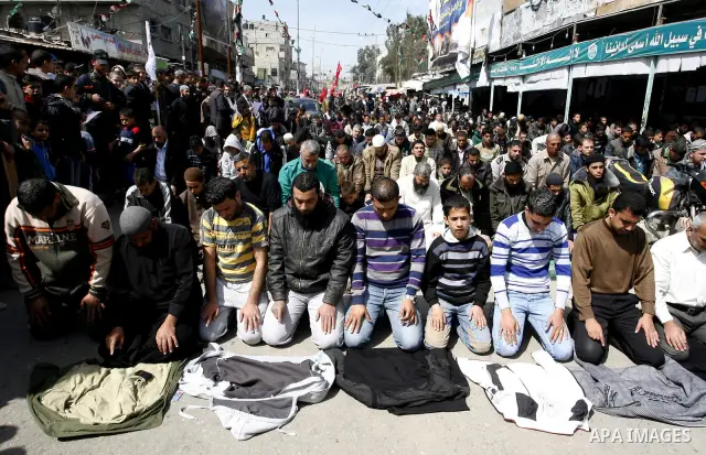 Palestinians pray in the Masjid Alawdh during the funeral of the Secretary-General of the Popular Resistance Committees, Zuhair al-Qaisi, after he was killed in an Israeli air strike on a car traveling in Rafah. Fourteen...