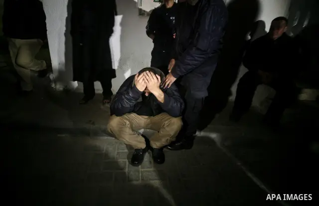 Relatives of Ahmed salem, 22-year-old, grieves over his body in the morgue of Al-Shifa hospital in Gaza City, on March 11, 2012, following a fresh Israeli air raid, bringing the death toll from strikes since March 10 to...