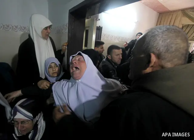 The mother of Ahmed Salim, one of the Nasser Salahaldin Brigades militants who was killed in an Israeli air strike, grieves during his funeral in Gaza City, on March 11, 2012. Photo by Ashraf Amra