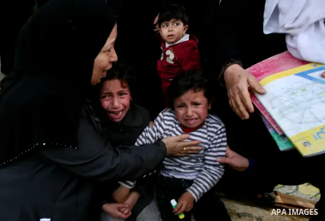 Palestinians women react during the funeral of 12 year old Ayoub Assalya killed in an Israeli airstrike in Jabaliya Refugee Camp, Gaza Strip Sunday, March 11, 2012. The worst round of violence in more than a year between...