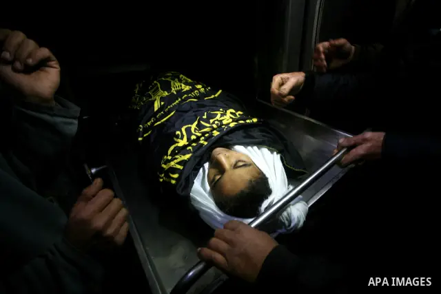 Palestinians carry the body of a 12 year old Ayoub Assalya during his funeral in Jabaliya Refugee Camp, Gaza Strip Sunday, March 11, 2012. The worst round of violence in more than a year between Israel and Gaza Strip Pal...