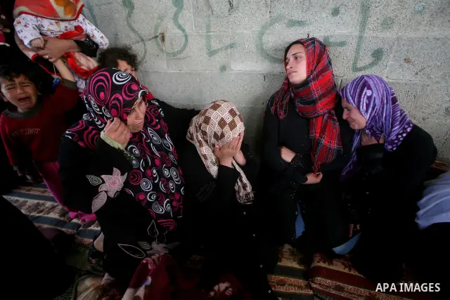 Palestinians women react during the funeral of 12 year old Ayoub Assalya killed in an Israeli airstrike in Jabaliya Refugee Camp, Gaza Strip Sunday, March 11, 2012. The worst round of violence in more than a year between...