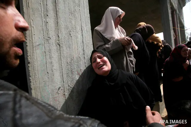 Palestinians women react during the funeral of 12 year old Ayoub Assalya killed in an Israeli airstrike in Jabaliya Refugee Camp, Gaza Strip Sunday, March 11, 2012. The worst round of violence in more than a year between...