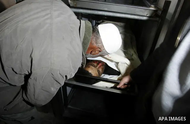 A Palestinian militant body is transported at a hospital Khan Younis in the southern Gaza Strip on March 12, 2012. Israeli air strikes killed two Palestinian militants and wounded 25 civilians in the Gaza Strip on Monday...