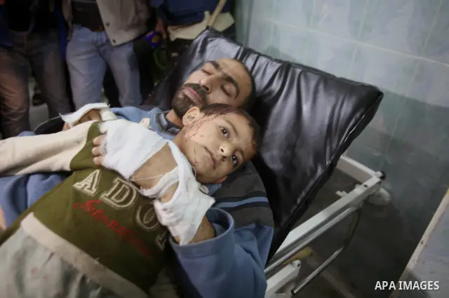Wounded Palestinian children receive medical atttention at a hospital in Beit Lahia in the northern Gaza Strip on March 12, 2012, following an Israeli air raid. Israeli war planes carried out new air strikes on Gaza over...