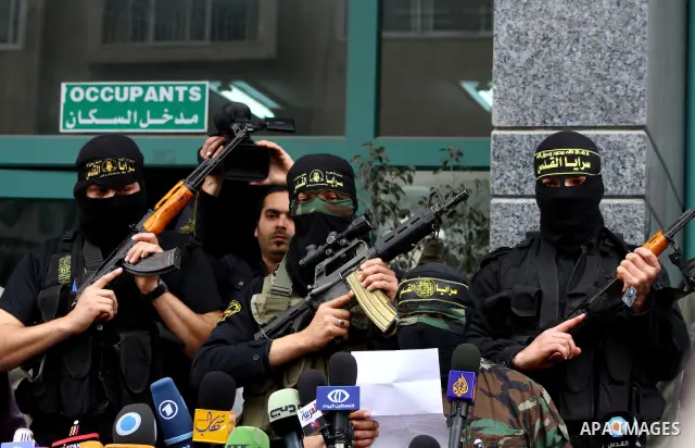 Islamic Jihad militants hold a news conference in Gaza City March 12, 2012. Israeli air strikes killed two Palestinian militants and a civilian in the Gaza Strip on Monday in a fourth day of cross-border hostilities, med...