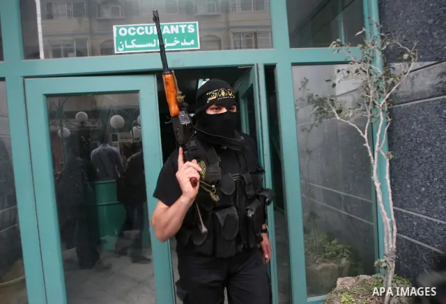 Islamic Jihad militants arrive to give a press conference in Gaza City on March 12, 2012, following overnight Israel air strikes on the Gaza Strip in which two Palestinians were killed. Photo by Ashraf Amra