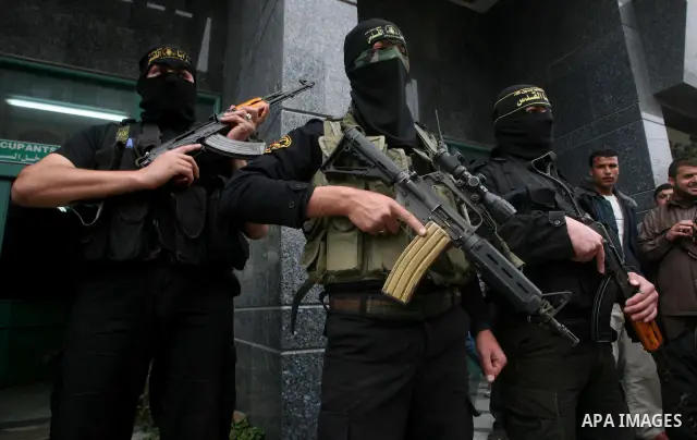 Islamic Jihad militants hold a news conference in Gaza City March 12, 2012. Israeli air strikes killed two Palestinian militants and a civilian in the Gaza Strip on Monday in a fourth day of cross-border hostilities, med...