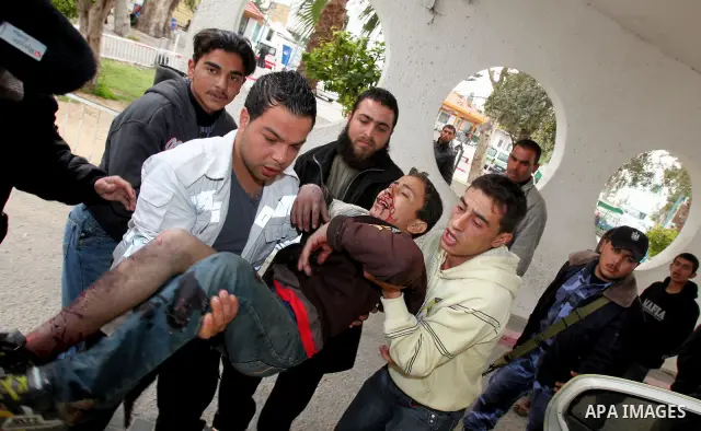 A wounded Palestinian boy is wheeled into a hospital in Gaza City, after an Israeli air strike March 12, 2012. Israeli air strikes killed two Palestinian militants and a civilian in the Gaza Strip on Monday in a fourth d...