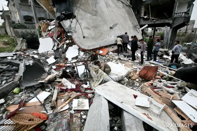 A Palestinian children in the rubble of a destroyed building following an Israeli air strike in the east of Jabaliya refugee camp on, 12 March 2012. Reports state that an Israeli air strike on the northern Gaza Strip's J...