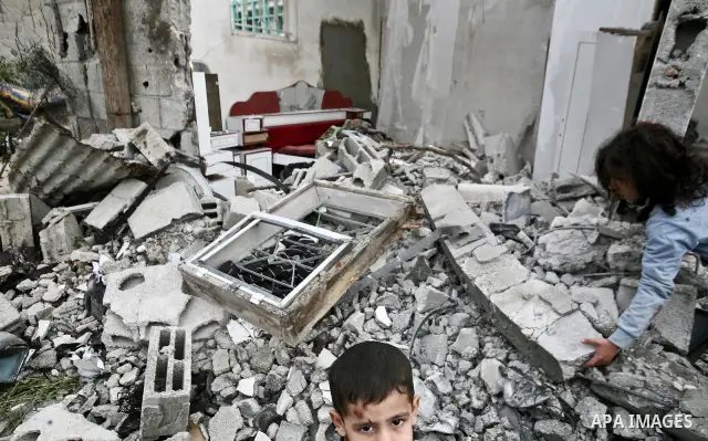 A Palestinian children in the rubble of a destroyed building following an Israeli air strike in the east of Jabaliya refugee camp on, 12 March 2012. Reports state that an Israeli air strike on the northern Gaza Strip's J...