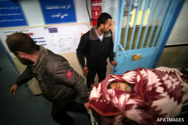 One of two Islamic Jihad militants who were killed in an Israeli airstrike on March 12, 2012 is transported into the morgue of Al-Shifa Hospital in Gaza city, as Israeli warplanes pounded Gaza for a fourth day, killing s...