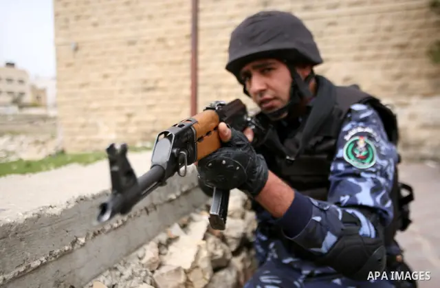 Members of the Palestinian security forces take position during a training drill in the West Bank city of Hebron March 12, 2012. Photo by Mamoun Wazwaz