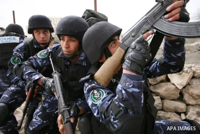 Members of the Palestinian security forces take position during a training drill in the West Bank city of Hebron March 12, 2012. Photo by Mamoun Wazwaz