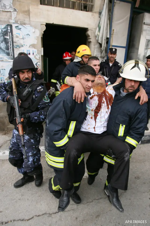 Members of the Palestinian security forces make a mock arrest during a training drill in the West Bank city of Hebron March 12, 2012. Photo by Mamoun Wazwaz