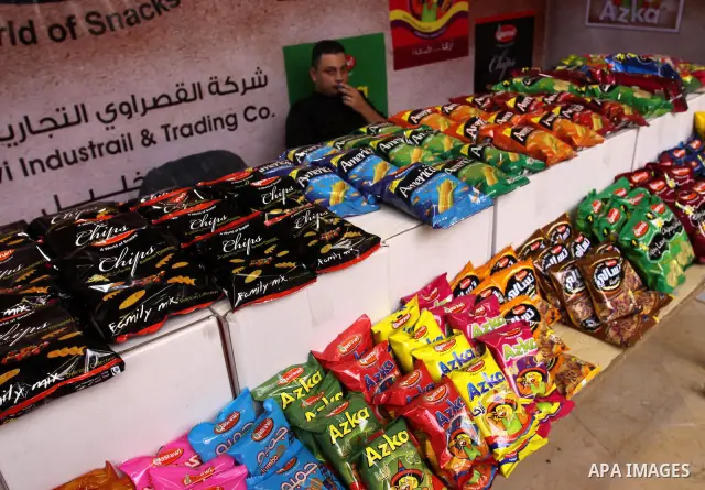Palestinians attend exhibition for Palestinian food in Gaza City on Mar. 13, 2012. to support the Palestinian national products. Photo by Mohammed Asad