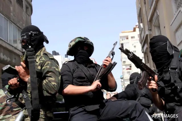 Members of al-Nasser Salah el dein brigades, attend press conference, in Gaza City, on Mar. 13, 2012. Photo by Mohammed Asad