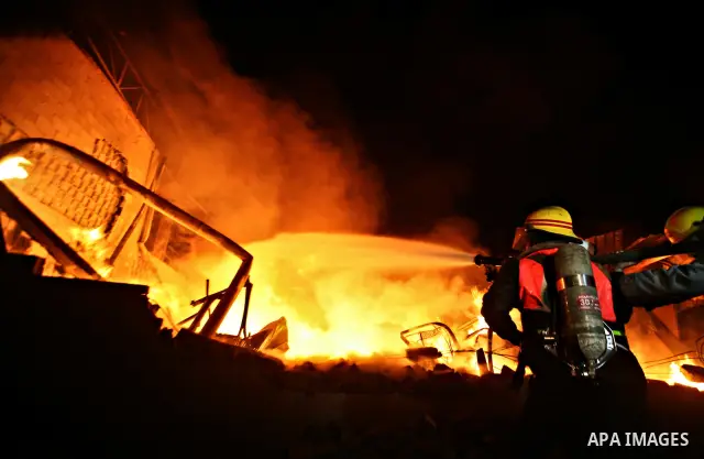 Palestinian fire fighters try to extinguish a blaze at a burning factory after an Israeli missile strike in the east of Gaza Strip on 14 March 2012. A fragile truce appeared to be taking hold between Israel and Palestini...
