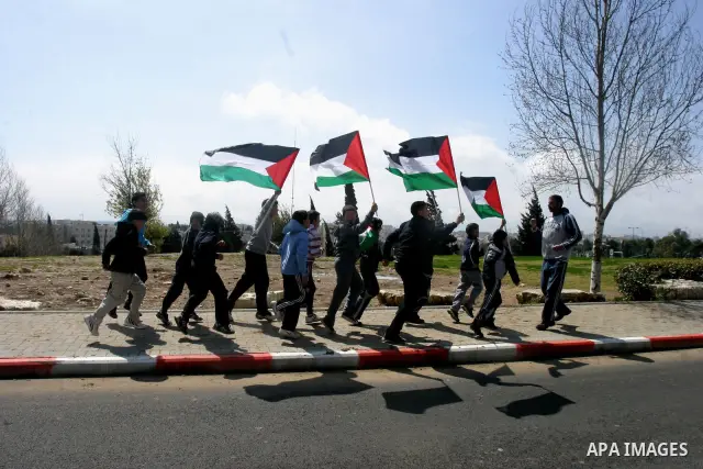 Marathon runners leave the Old City of Jerusalem during the Jerusalem Marathon, in Jerusalem, 16 March 2012. It is the second year the Jerusalem Marathon has been organized and the three events, a full marathon, a half m...