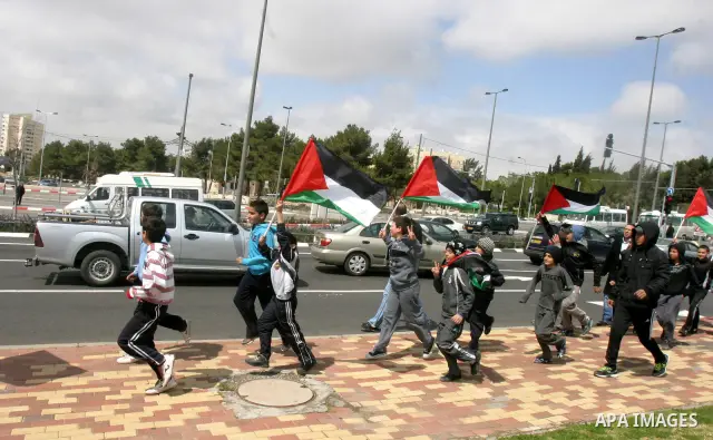 Marathon runners leave the Old City of Jerusalem during the Jerusalem Marathon, in Jerusalem, 16 March 2012. It is the second year the Jerusalem Marathon has been organized and the three events, a full marathon, a half m...